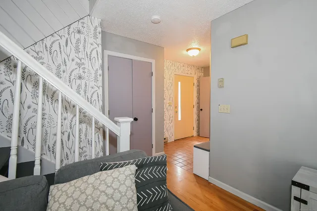 a view of entryway with wooden floor