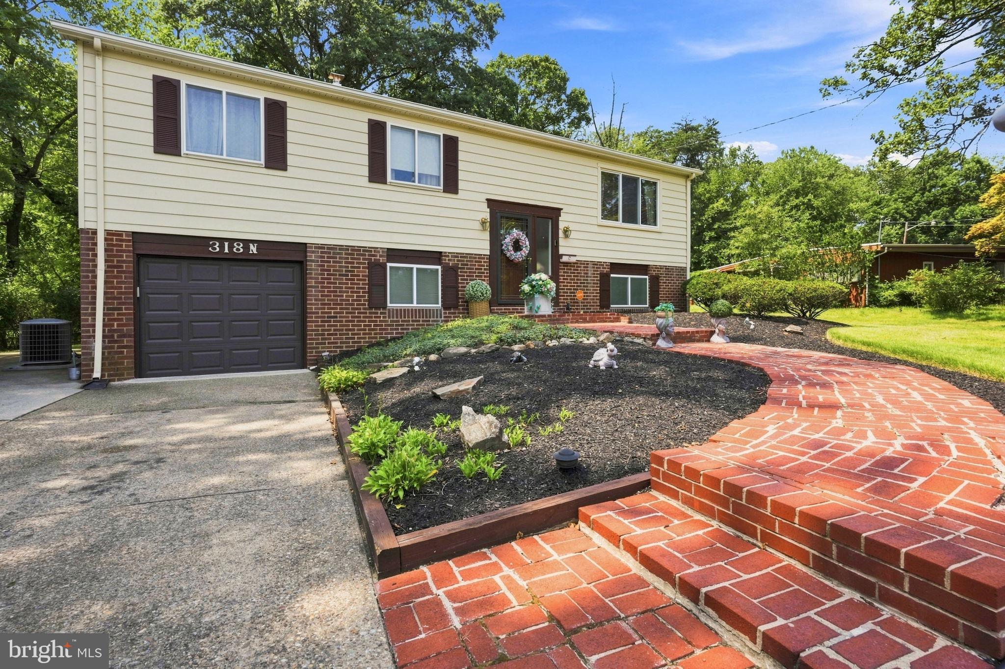 318 Warwick Road Lawnside, NJ 08045 - Photo 3 of 25 Charming home with lush landscaping.