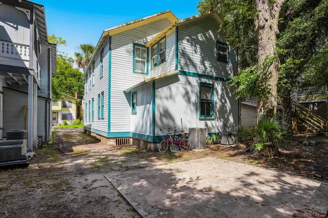 a backyard of a house with barbeque oven