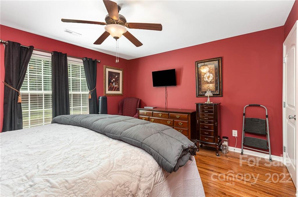 155 Rose Brier Lane. Salisbury, NC 28146 - Photo 14 of 32 a bedroom with a bed and a chandelier