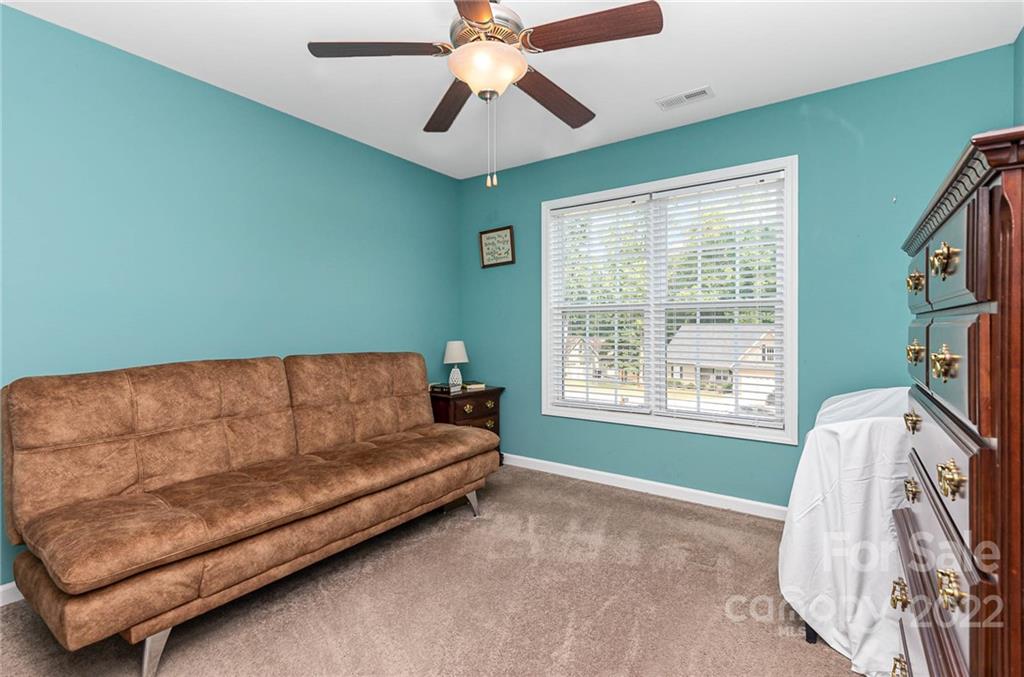 155 Rose Brier Lane. Salisbury, NC 28146 - Photo 17 of 32 a living room with a couch and a chandelier