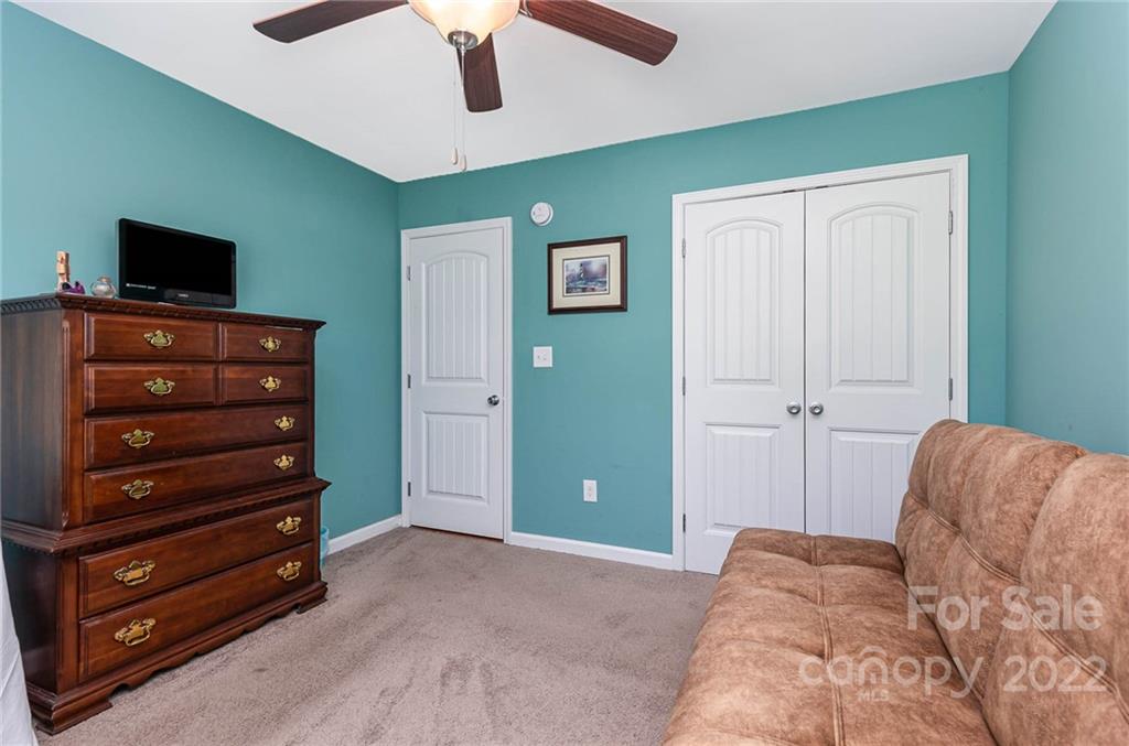 155 Rose Brier Lane. Salisbury, NC 28146 - Photo 18 of 32 a bedroom with a bed and a television