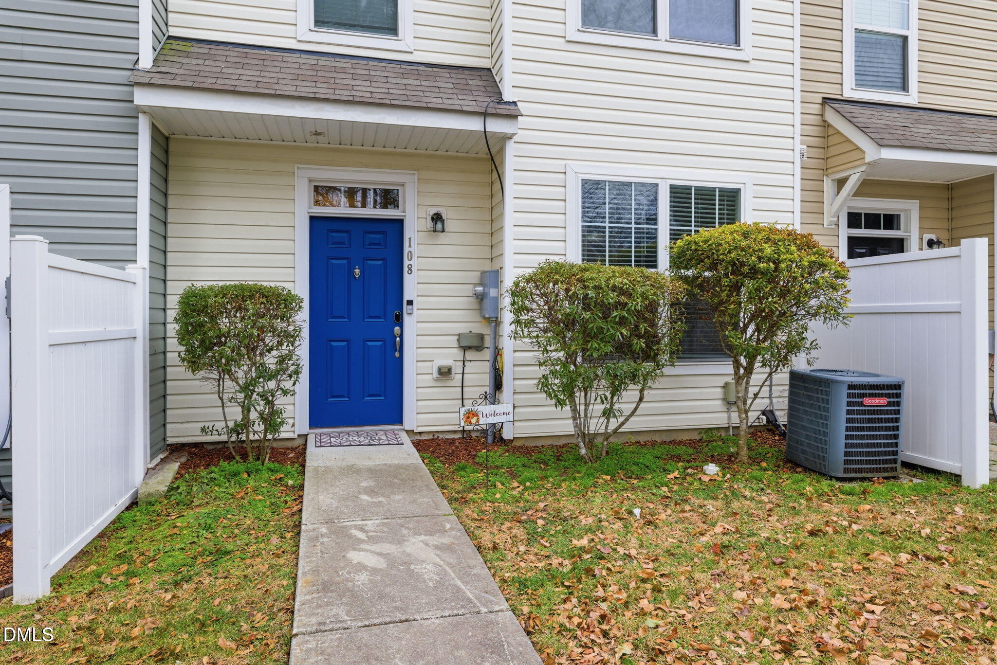 401 Coalinga Lane, Unit 108 Raleigh, NC 27610 - Photo 2 of 28 a front view of a house with garden