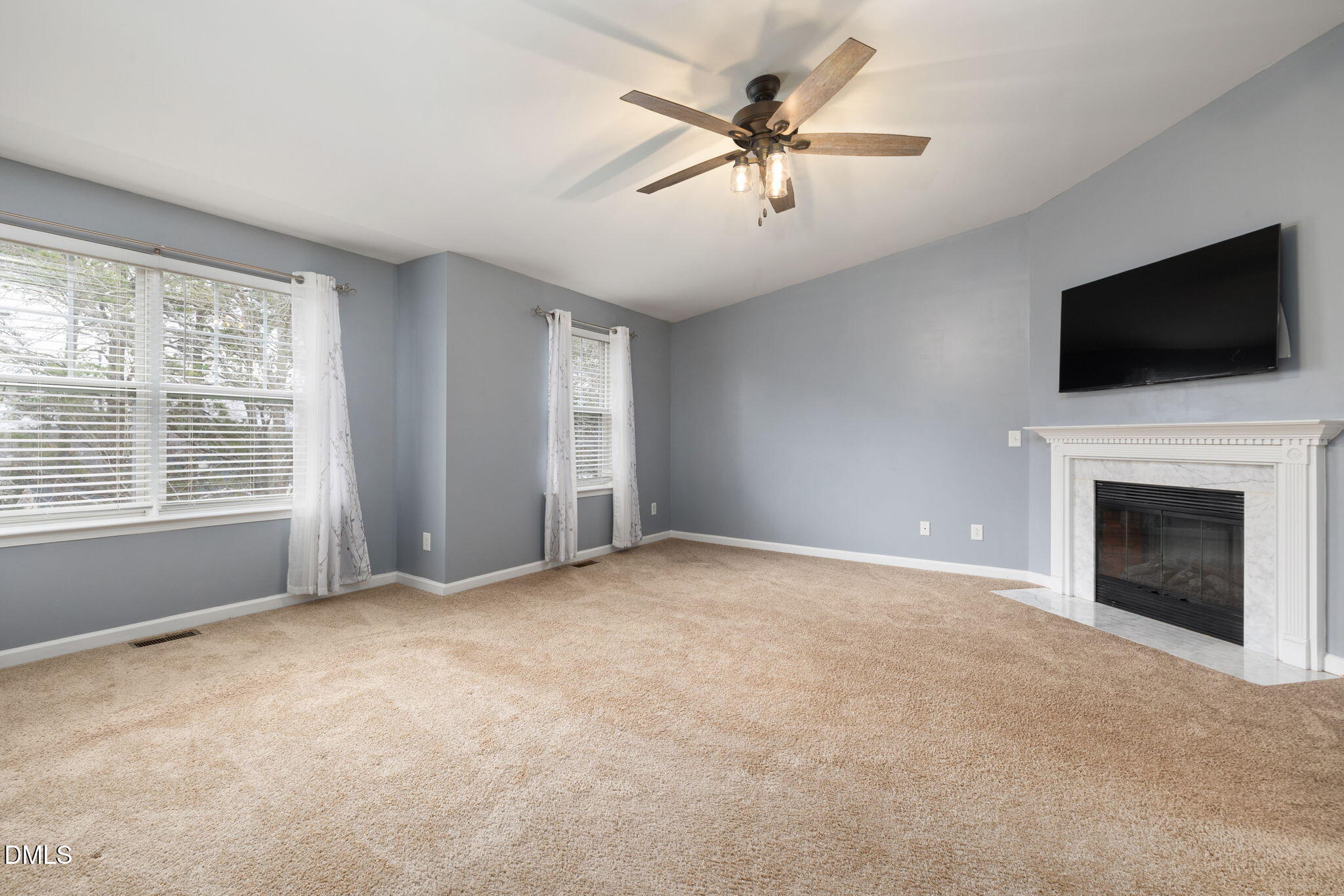 401 Coalinga Lane, Unit 108 Raleigh, NC 27610 - Photo 22 of 28 a view of an empty room with window and fireplace