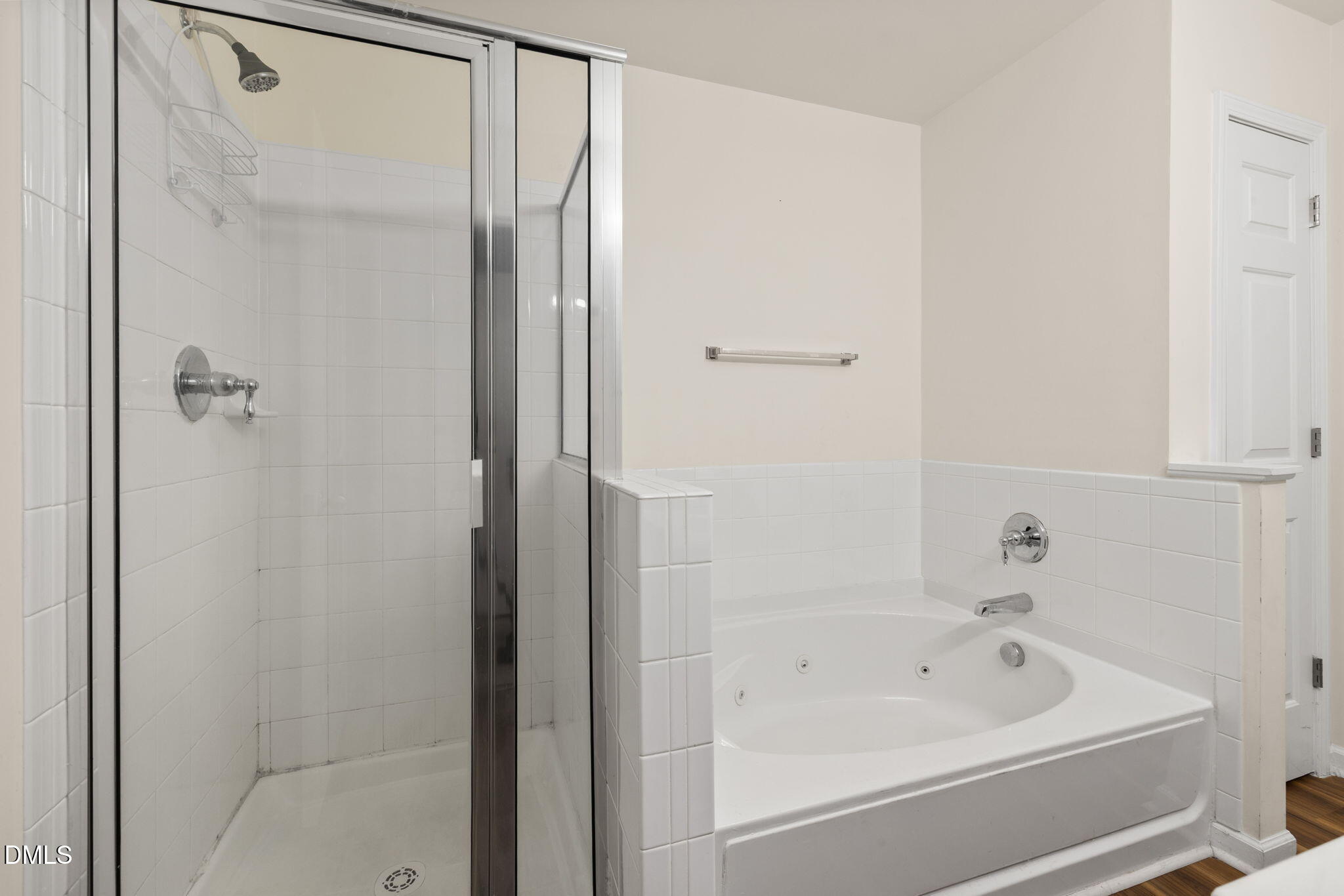 401 Coalinga Lane, Unit 108 Raleigh, NC 27610 - Photo 24 of 28 a bathroom with a bathtub and a shower
