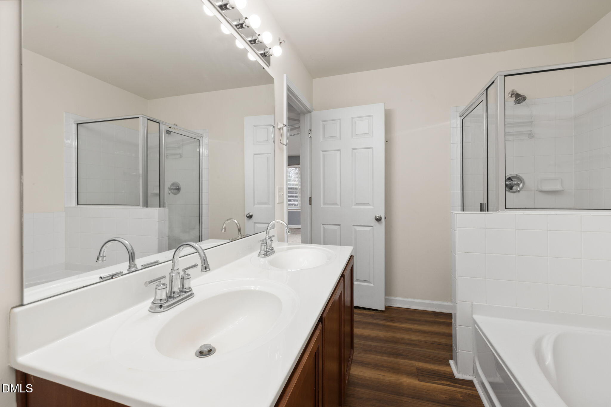 401 Coalinga Lane, Unit 108 Raleigh, NC 27610 - Photo 25 of 28 a bathroom with a sink and a mirror
