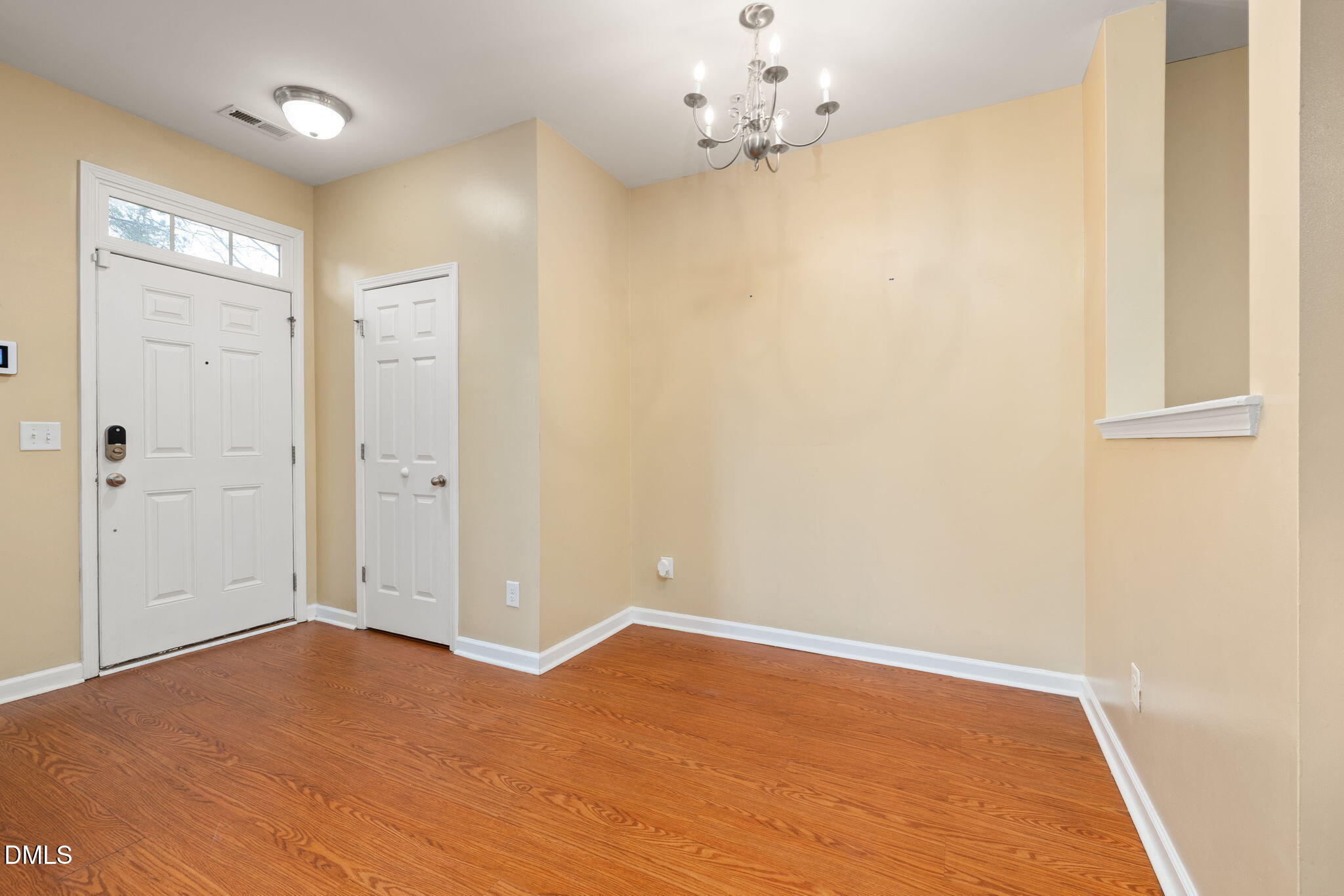 401 Coalinga Lane, Unit 108 Raleigh, NC 27610 - Photo 3 of 28 a view of empty room with wooden floor