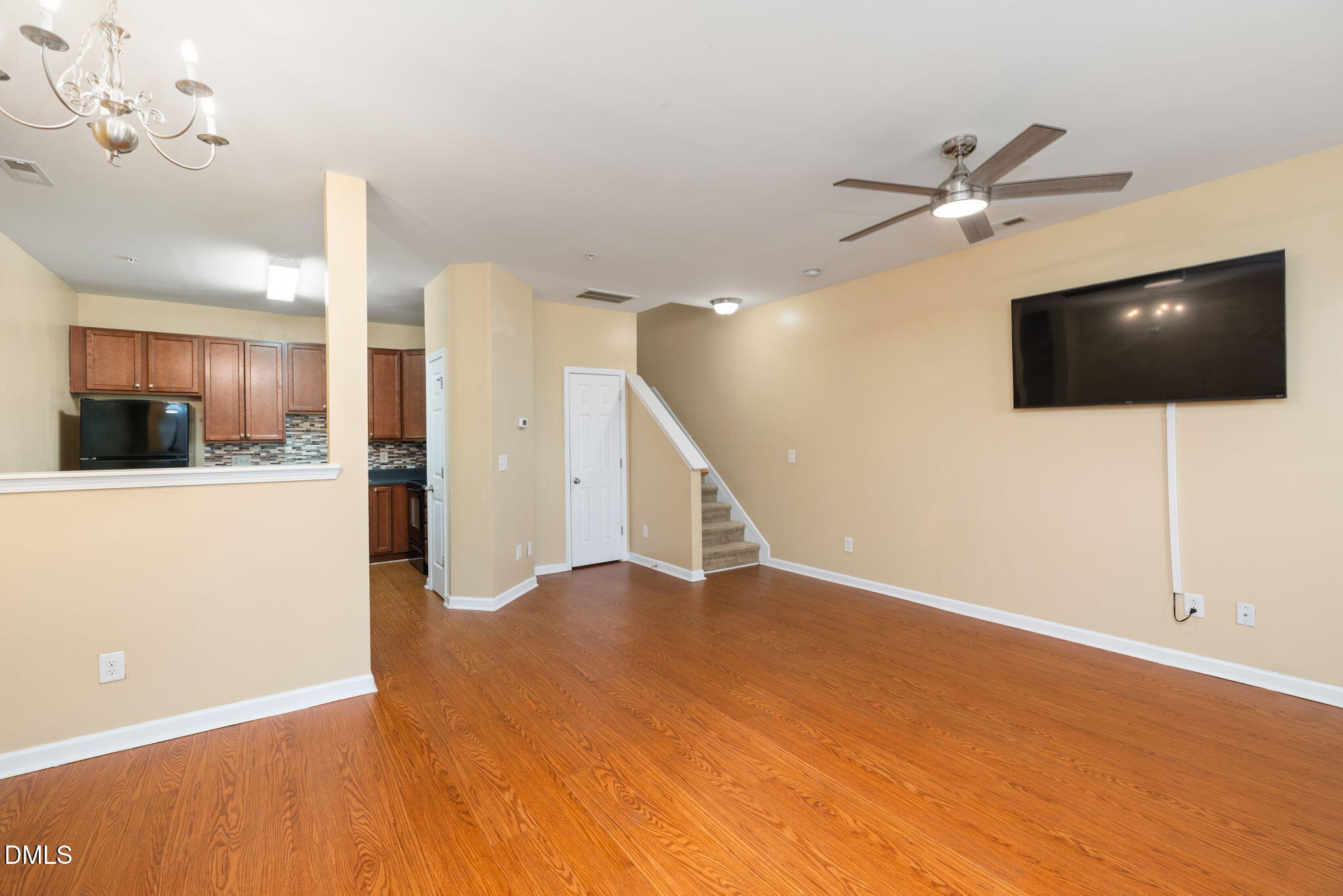 401 Coalinga Lane, Unit 108 Raleigh, NC 27610 - Photo 4 of 28 a view of a livingroom with furniture and a flat screen tv