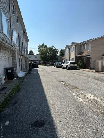 a view of a street with residential houses