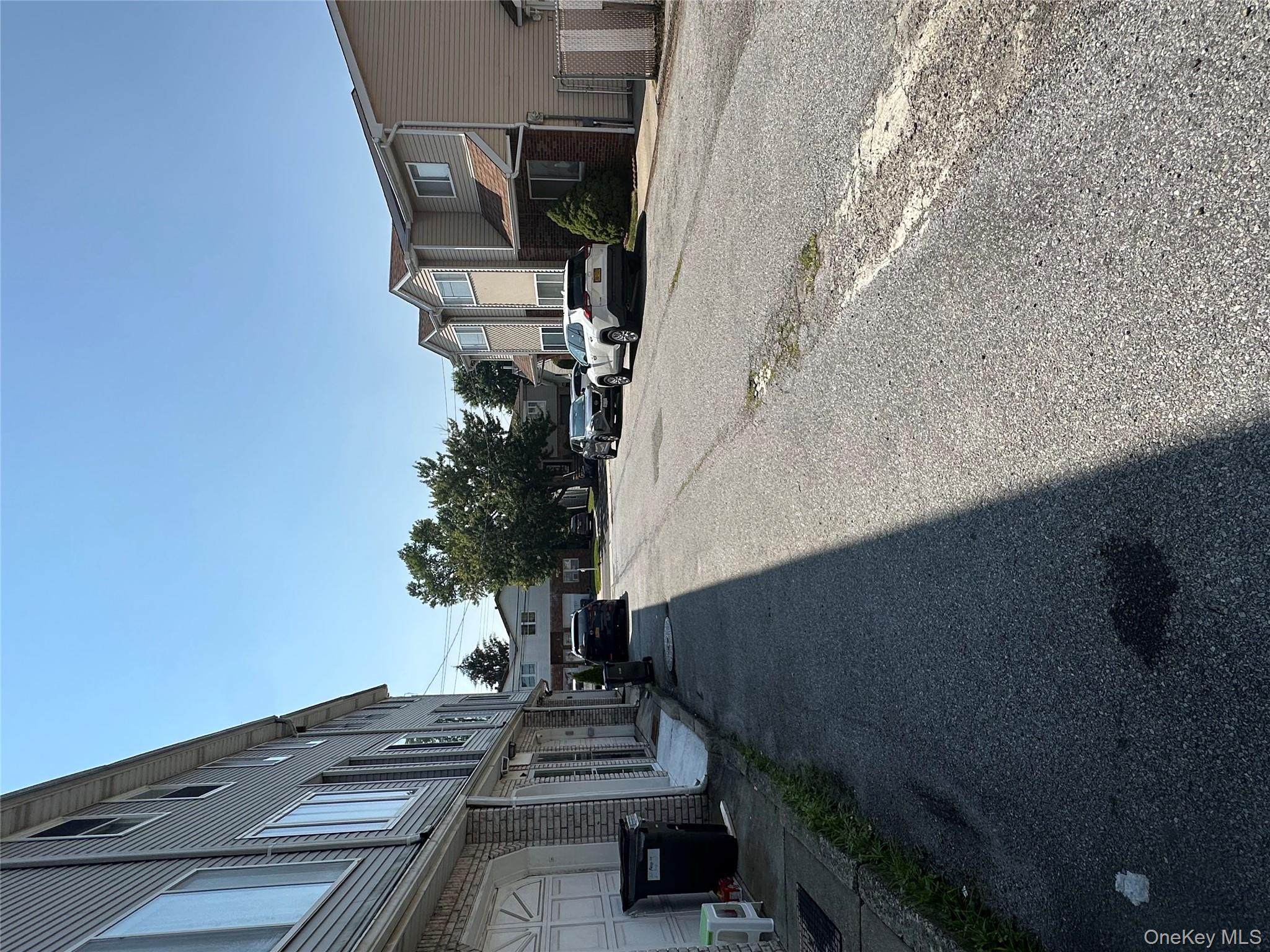 a view of a street with residential houses