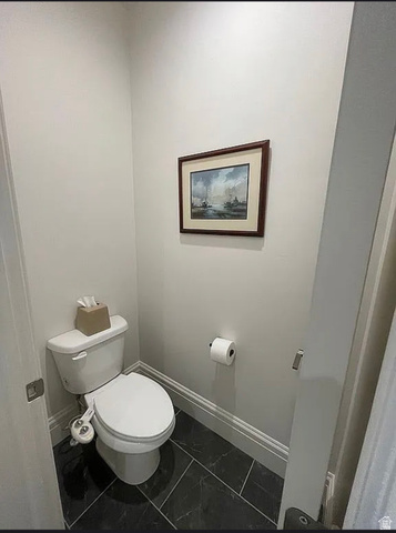 838 East Mountain Road North Ogden, UT 84414 - Photo 21 of 37 Powder room featuring a white toilet with bidet attachment, dark gray tile flooring, and light gray wall paint