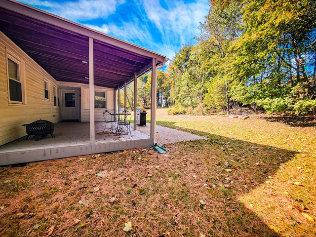 a view of a backyard of the house