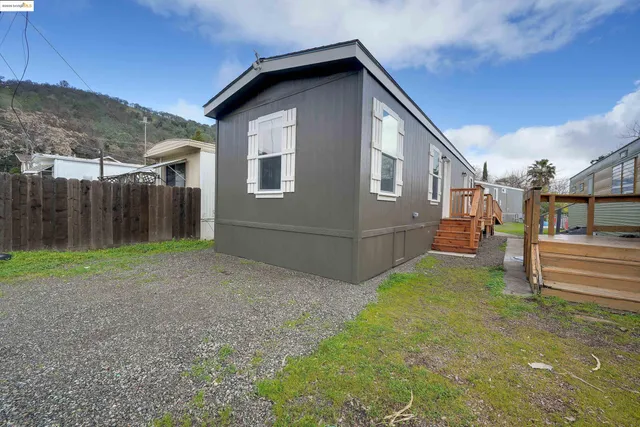a house view with a backyard space