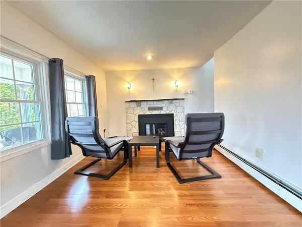 a fireplace with a clock on wall