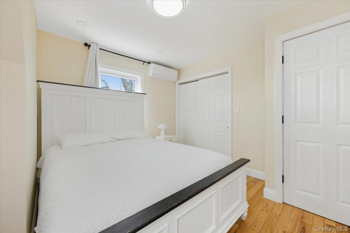 66 Elm Street Valley Stream, NY 11580 - Photo 16 of 23 a bedroom with a bed and a hallway