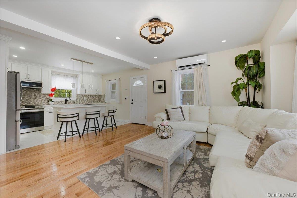 66 Elm Street Valley Stream, NY 11580 - Photo 2 of 23 a living room with furniture and a table