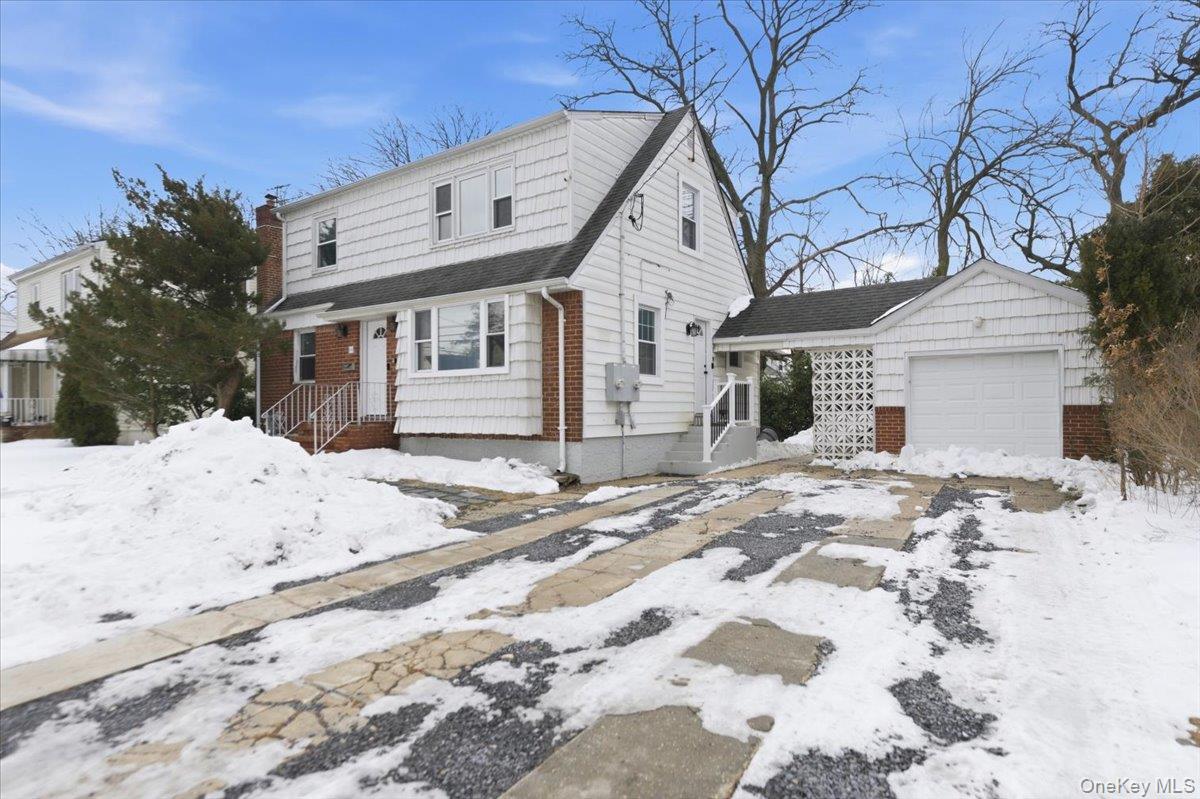 66 Elm Street Valley Stream, NY 11580 - Photo 23 of 23 a front view of a house with a yard