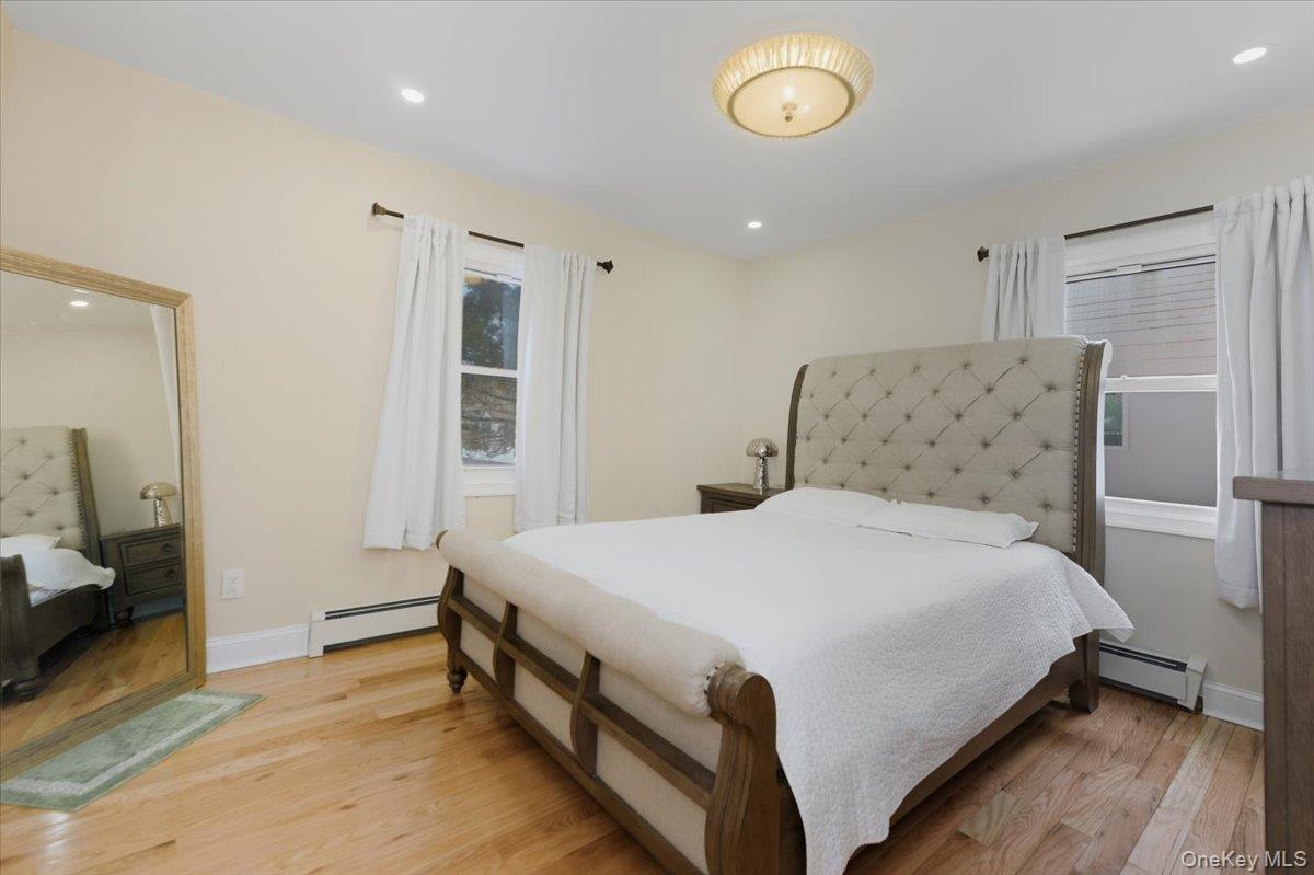 66 Elm Street Valley Stream, NY 11580 - Photo 7 of 23 a bedroom with a bed and a window