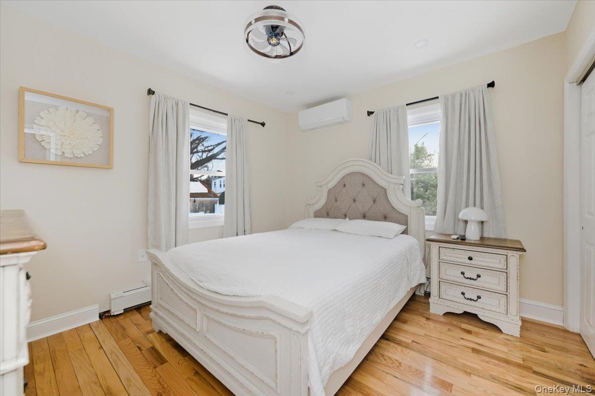 66 Elm Street Valley Stream, NY 11580 - Photo 8 of 23 a bedroom with a bed and a window