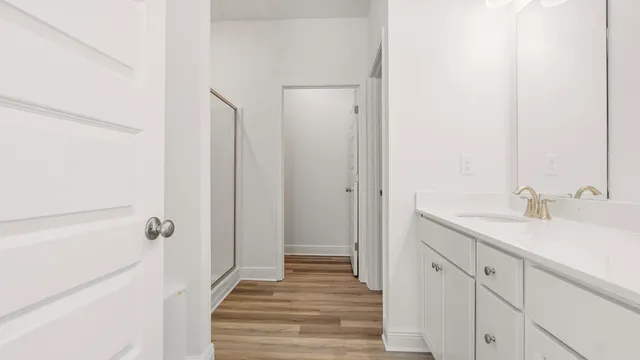 a bathroom with a glass shower door