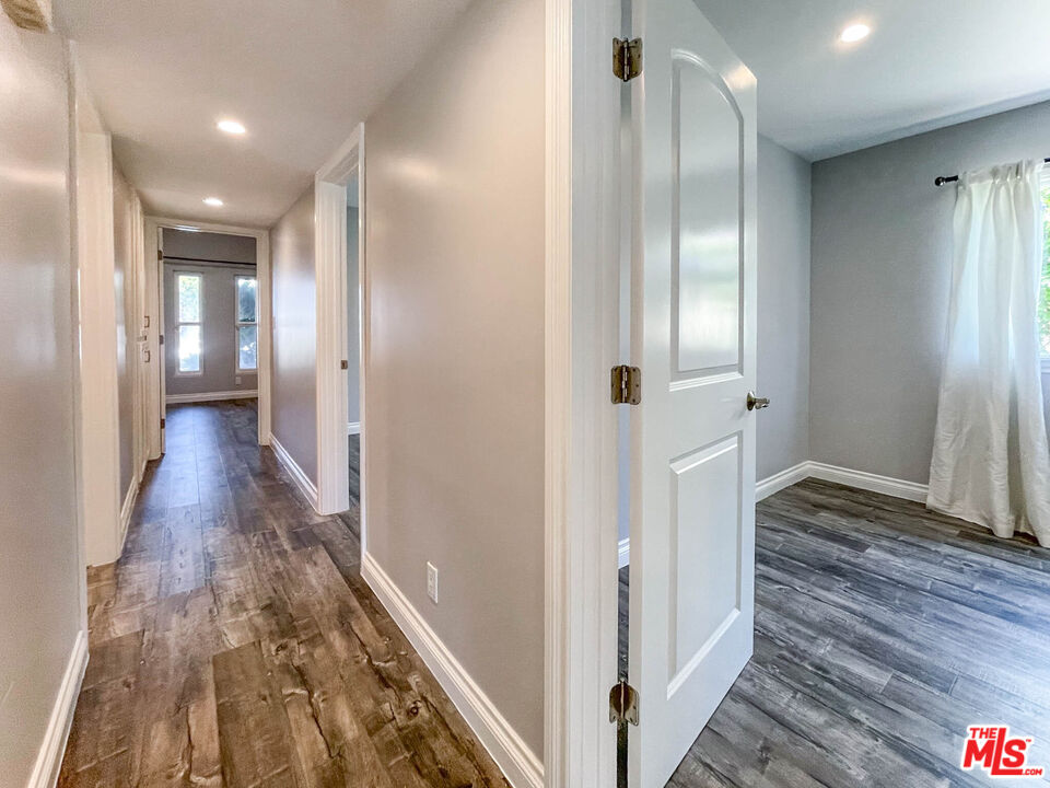 3824 Surfwood Road Malibu, CA 90265 - Photo 14 of 36 a view of hallway with wooden floor
