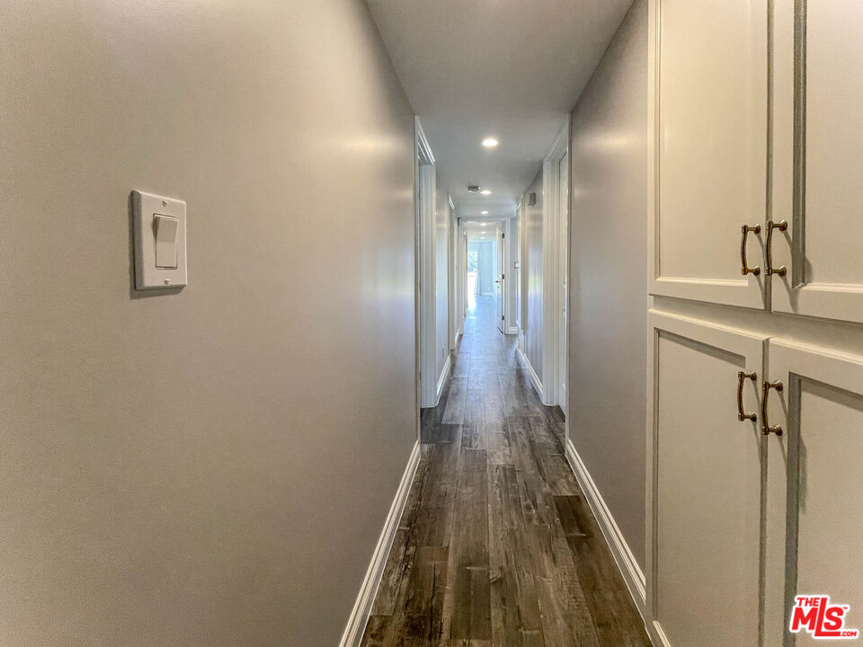 3824 Surfwood Road Malibu, CA 90265 - Photo 17 of 36 a bathroom with a sink and a mirror