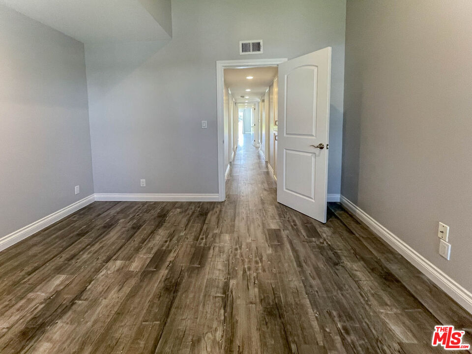 3824 Surfwood Road Malibu, CA 90265 - Photo 20 of 36 a view of a room with wooden floor and staircase