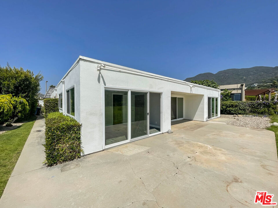 3824 Surfwood Road Malibu, CA 90265 - Photo 23 of 36 a view of a house with a yard