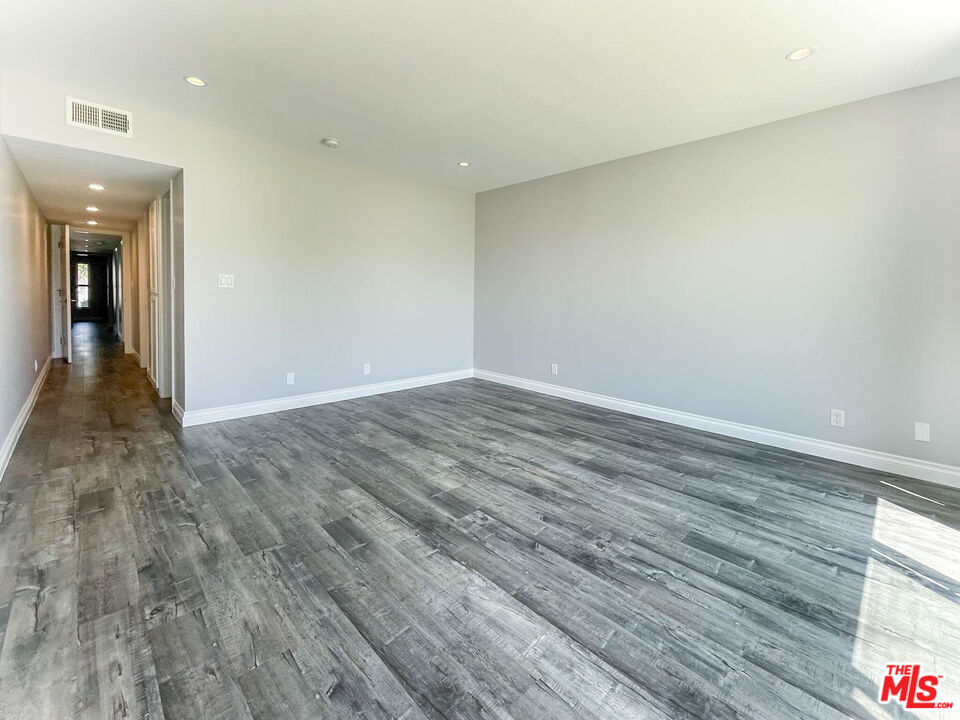 3824 Surfwood Road Malibu, CA 90265 - Photo 29 of 36 wooden floor in an empty room