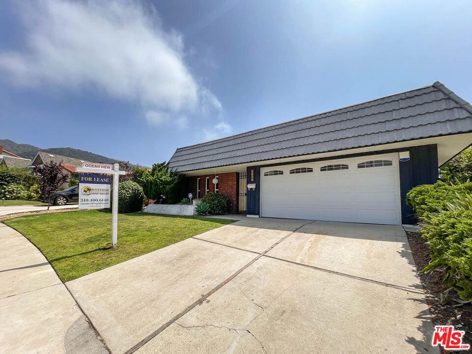 3824 Surfwood Road Malibu, CA 90265 - Photo 35 of 36 a house view with a garden space