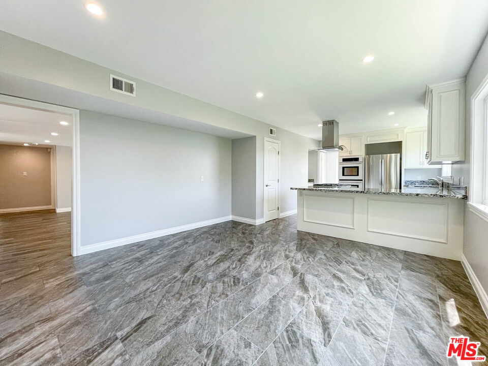 3824 Surfwood Road Malibu, CA 90265 - Photo 6 of 36 a view of a kitchen with a sink and a stove top oven