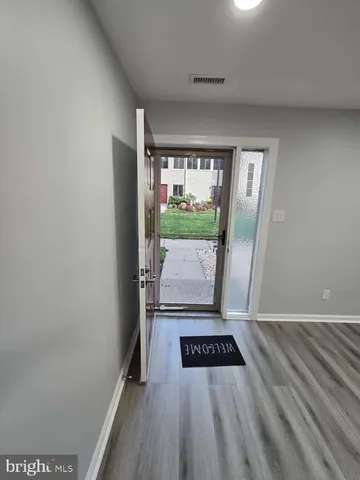 an empty room with large window