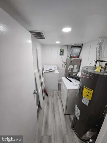 a storage room with washer and dryer