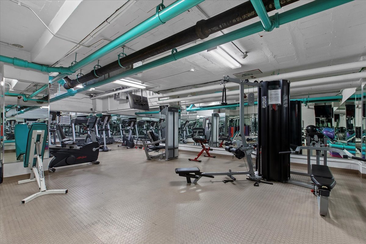 850 North Dewitt Place, Unit 7F Chicago, IL 60611 - Photo 11 of 13 a view of a room with gym equipment