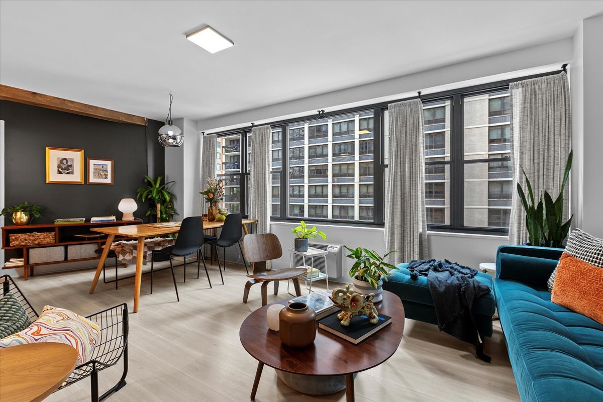 850 North Dewitt Place, Unit 7F Chicago, IL 60611 - Photo 7 of 13 a living room with furniture and a large window