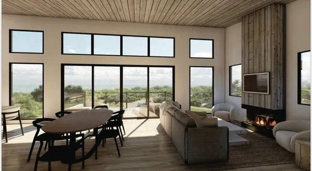 a living room with furniture tv and a large window