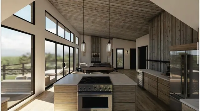a kitchen with stainless steel appliances granite countertop a stove and a refrigerator