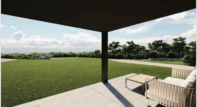a balcony with table and chairs
