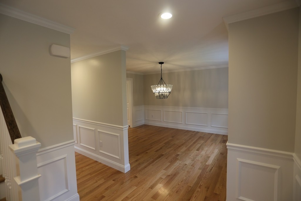 Lot 6 Littleton Road Ayer, MA 01432 - Photo 6 of 11 an empty room with wooden floor and staircase