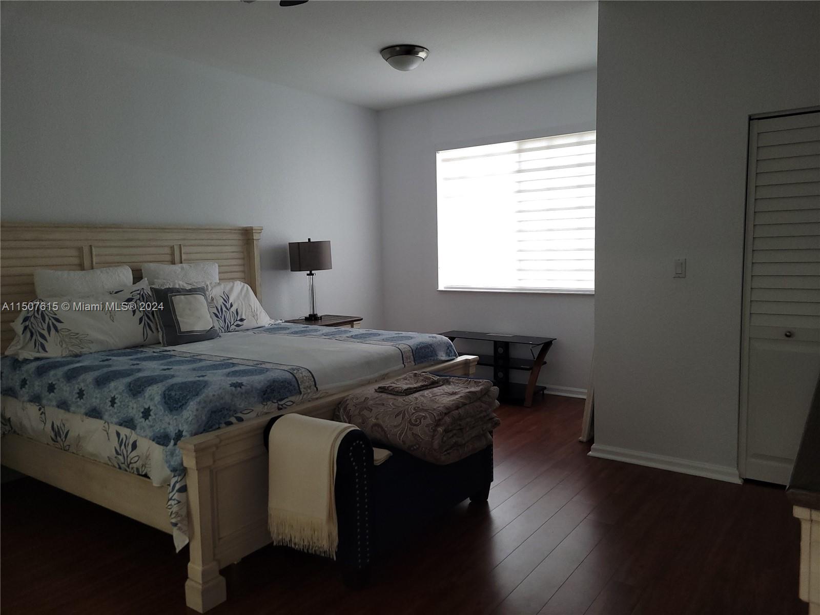 293 Las Brisas Circle Sunrise, FL 33326 - Photo 27 of 69 a bedroom with a bed and a window