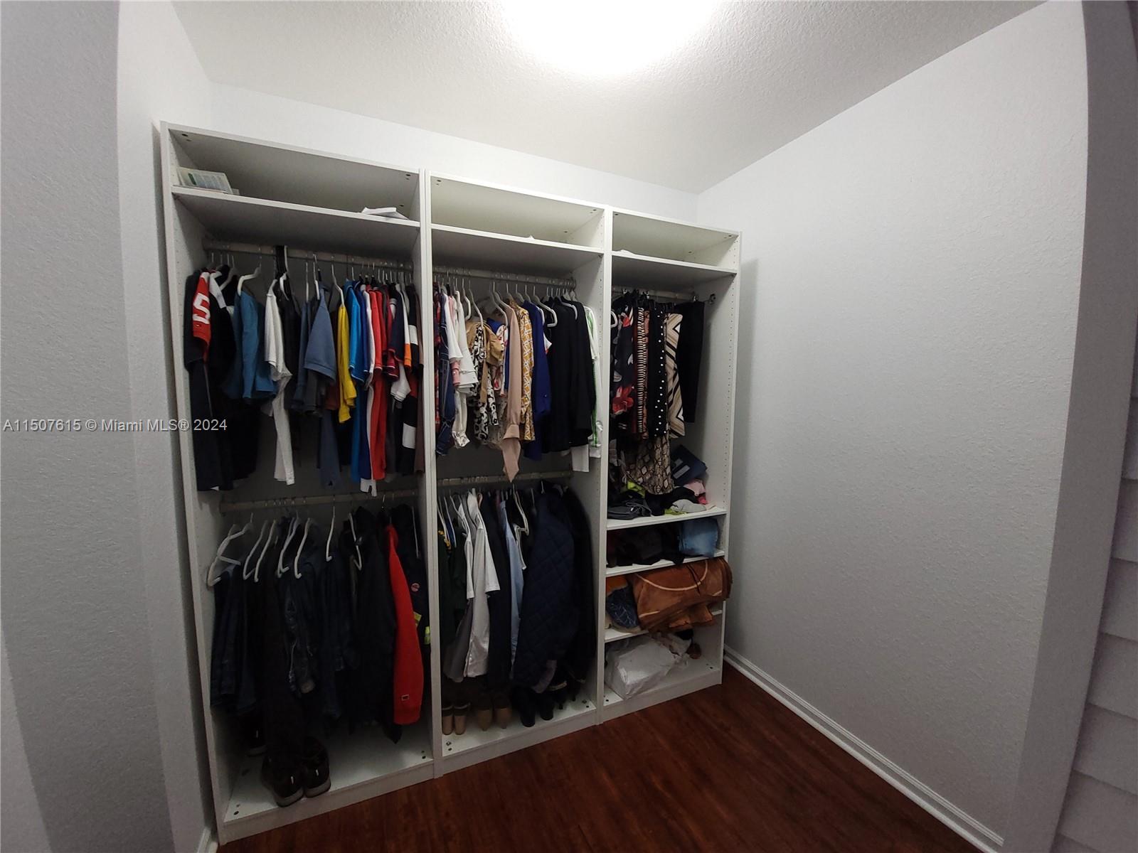293 Las Brisas Circle Sunrise, FL 33326 - Photo 29 of 69 a view of walk in closet with clothes
