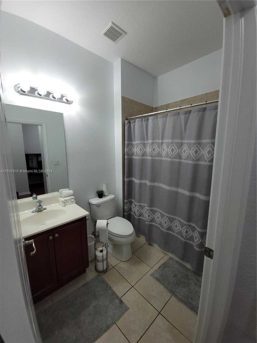 293 Las Brisas Circle Sunrise, FL 33326 - Photo 44 of 69 a bathroom with a sink a toilet and shower