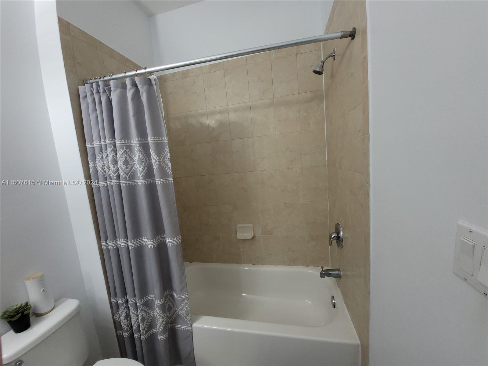293 Las Brisas Circle Sunrise, FL 33326 - Photo 45 of 69 a bathroom with a shower and a tub