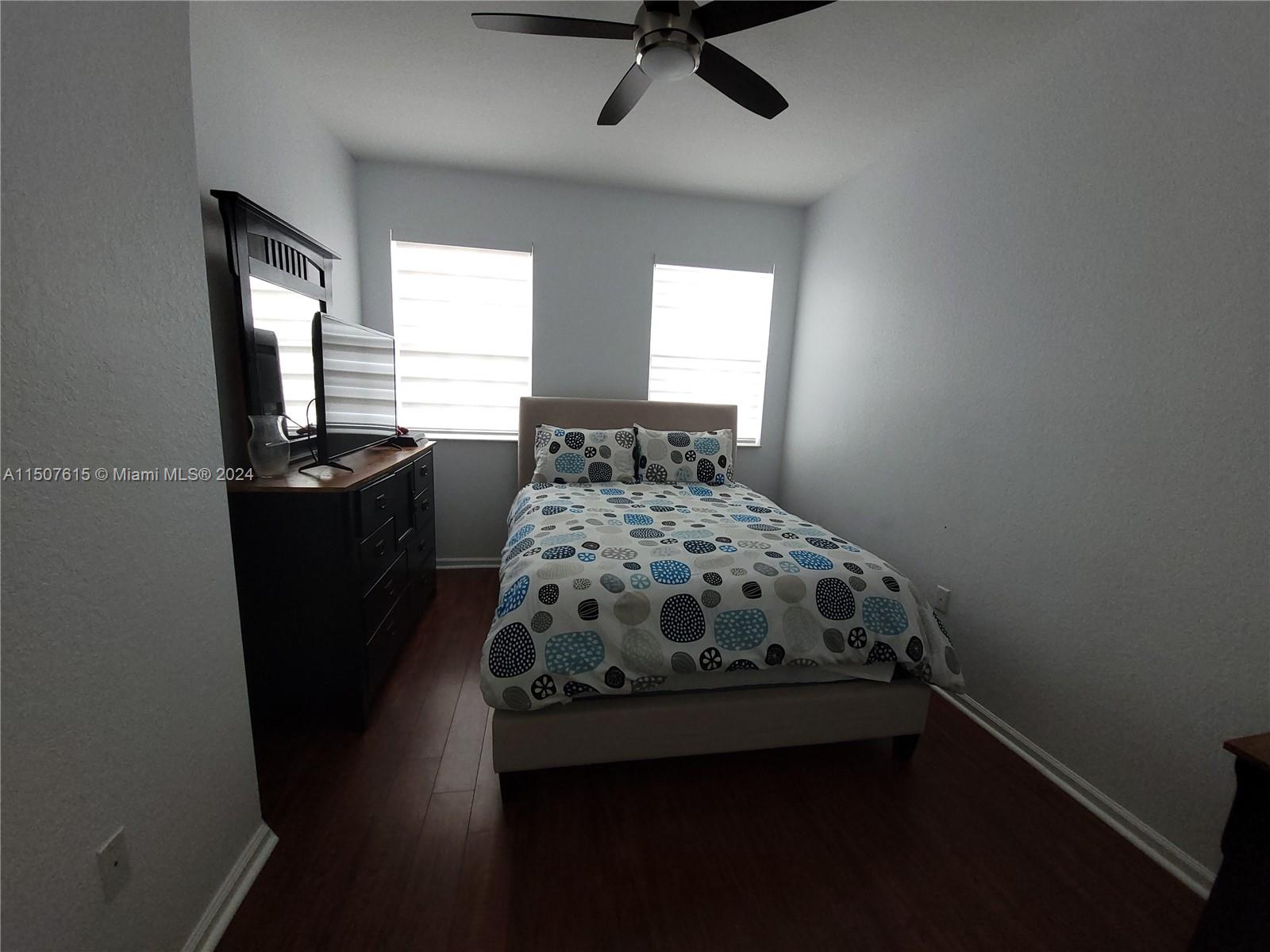 293 Las Brisas Circle Sunrise, FL 33326 - Photo 47 of 69 a bedroom with a bed and a window