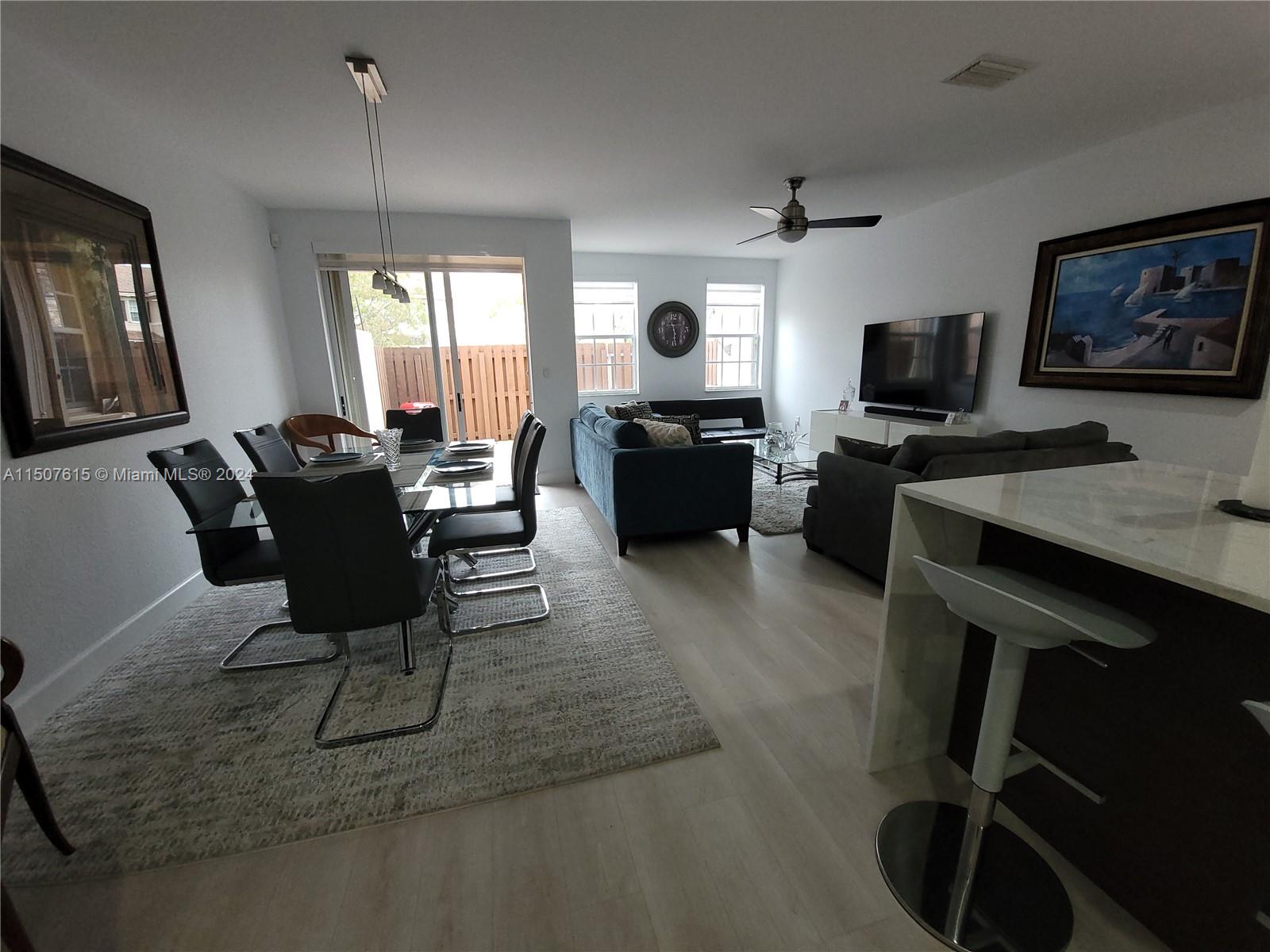 293 Las Brisas Circle Sunrise, FL 33326 - Photo 5 of 69 a living room with furniture a window and a flat screen tv