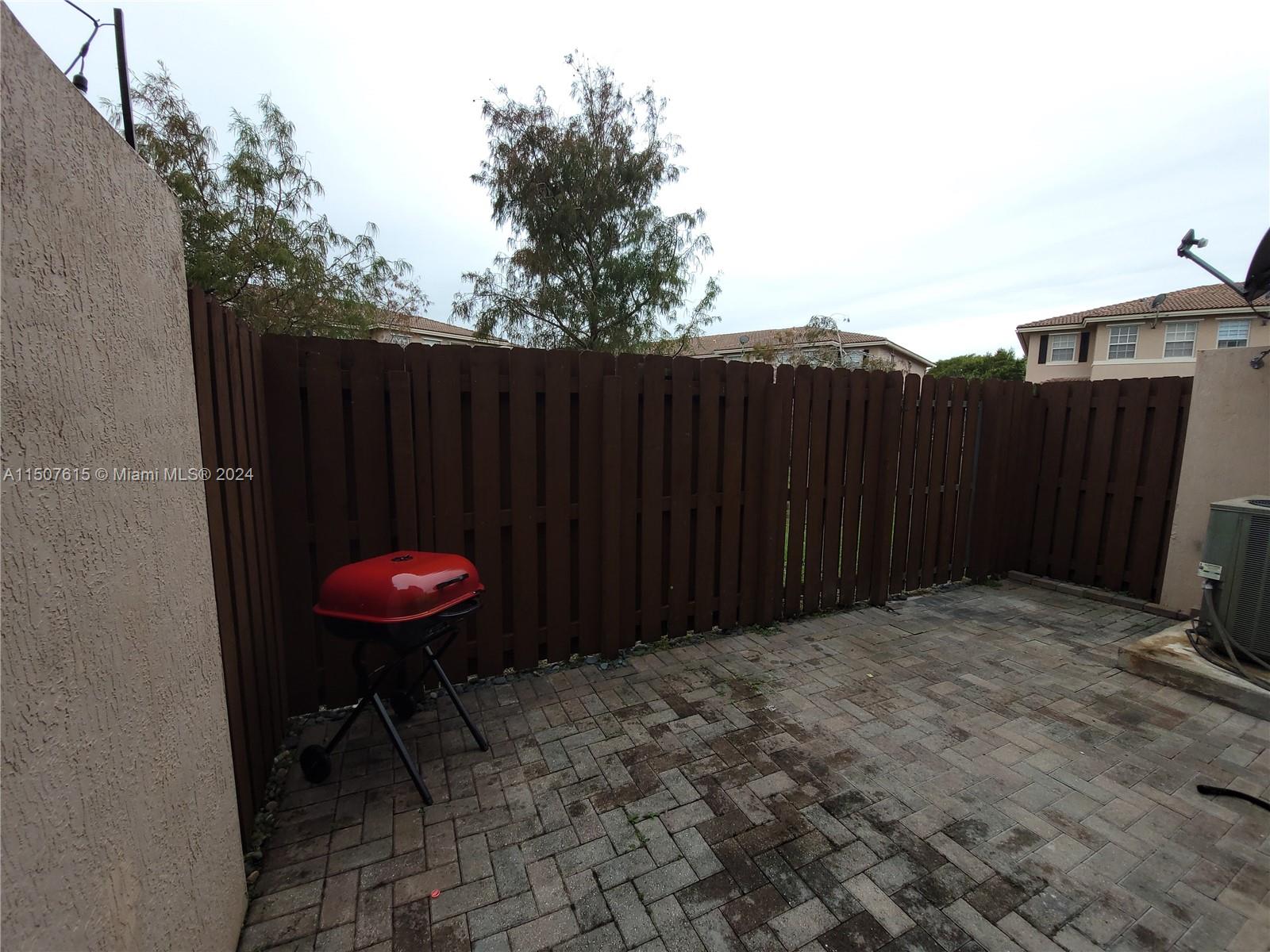 293 Las Brisas Circle Sunrise, FL 33326 - Photo 60 of 69 a view of a backyard