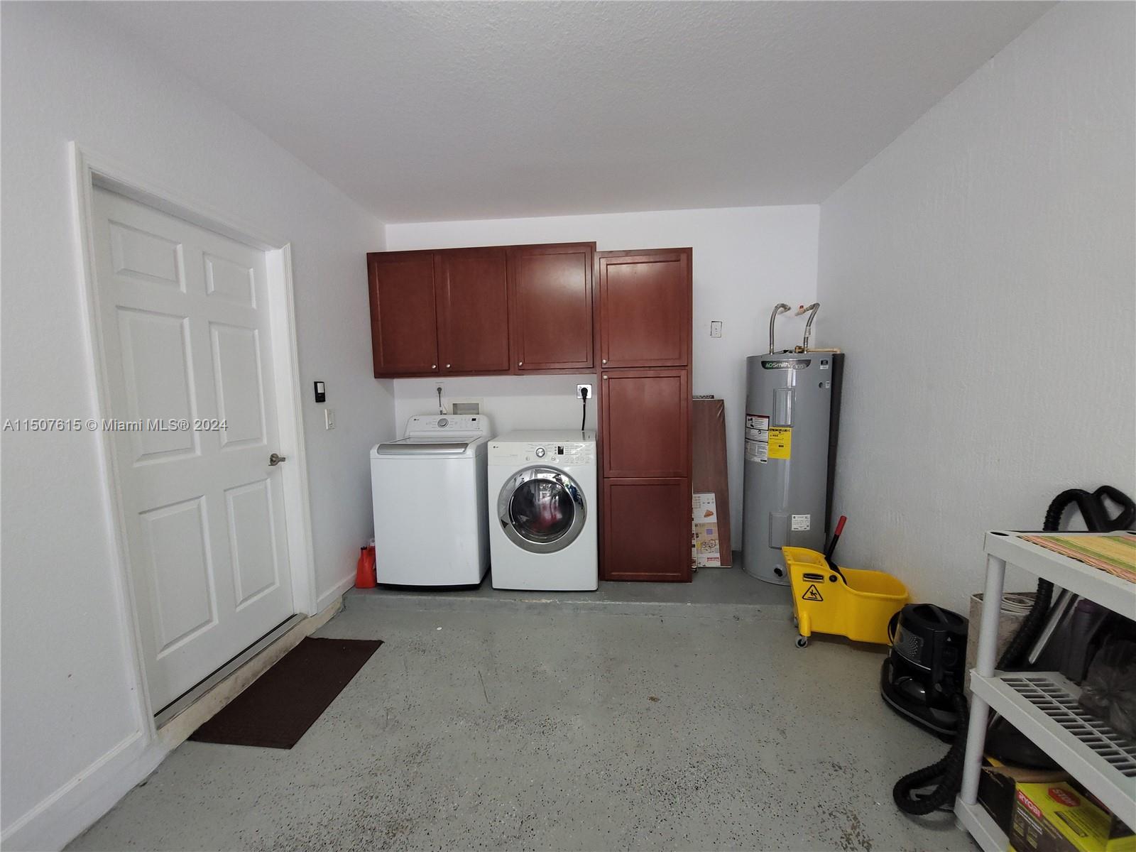 293 Las Brisas Circle Sunrise, FL 33326 - Photo 61 of 69 a utility room with dryer and washer
