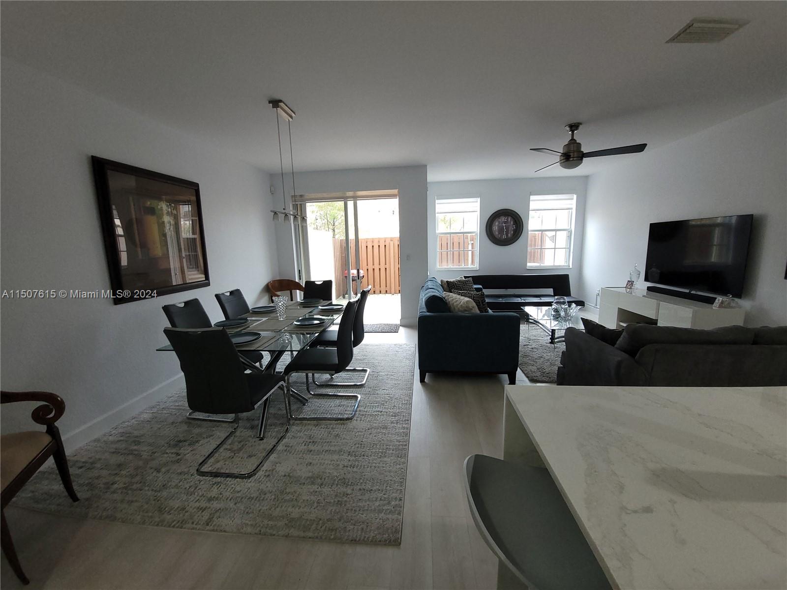 293 Las Brisas Circle Sunrise, FL 33326 - Photo 10 of 69 a living room with furniture and a flat screen tv