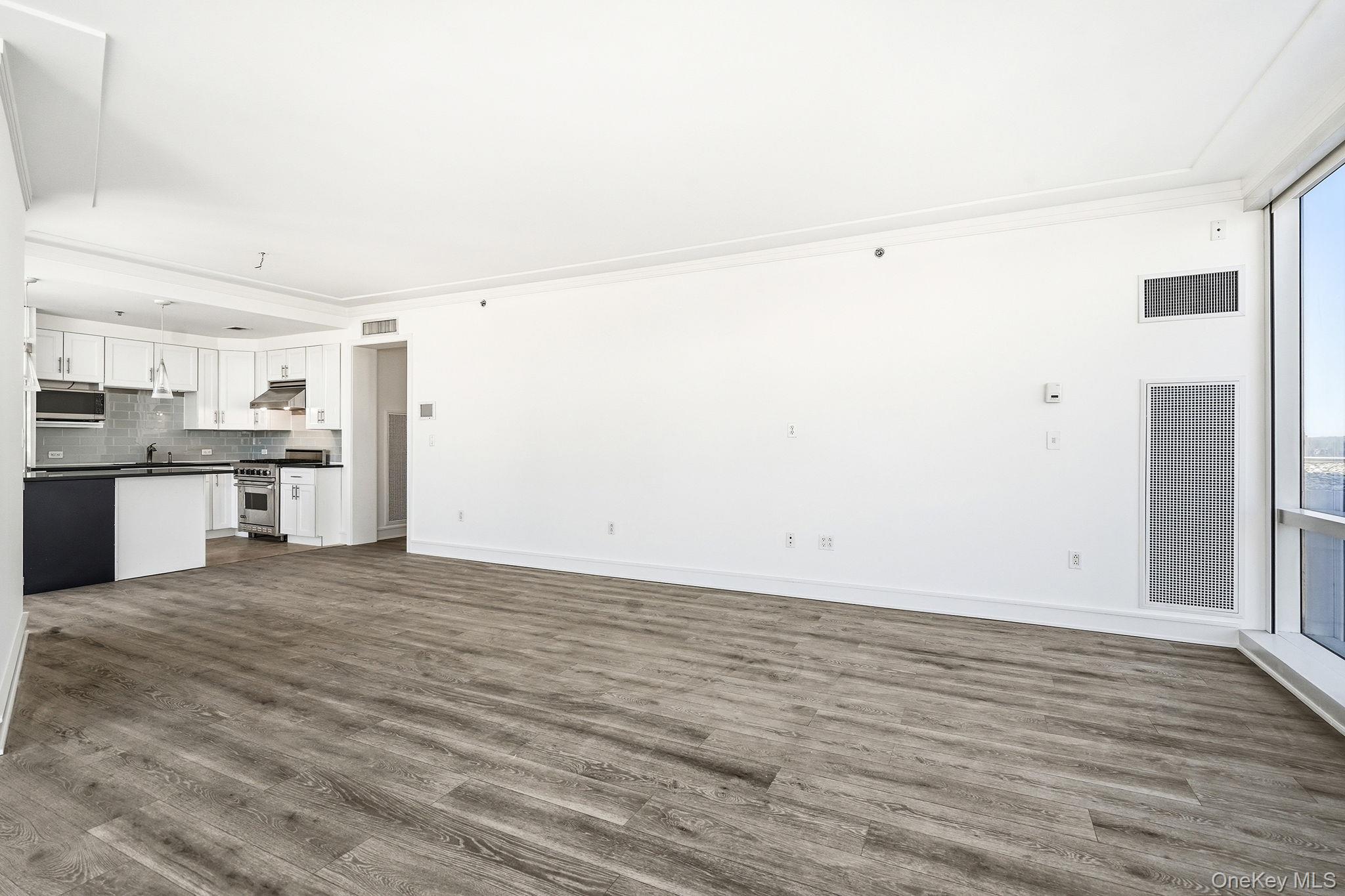 1 Renaissance Square, Unit 11G White Plains, NY 10601 - Photo 11 of 28 a view of kitchen with wooden floor