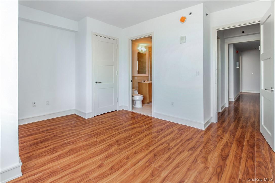 1 Renaissance Square, Unit 11G White Plains, NY 10601 - Photo 11 of 23 a view of empty room with wooden floor